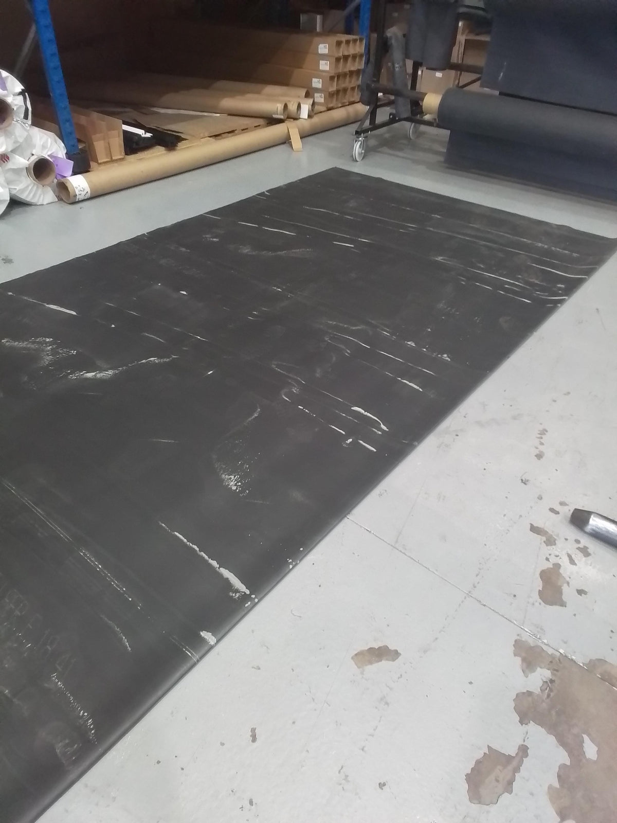 Close up of chalking on the surface of a seconds EPDM sheet