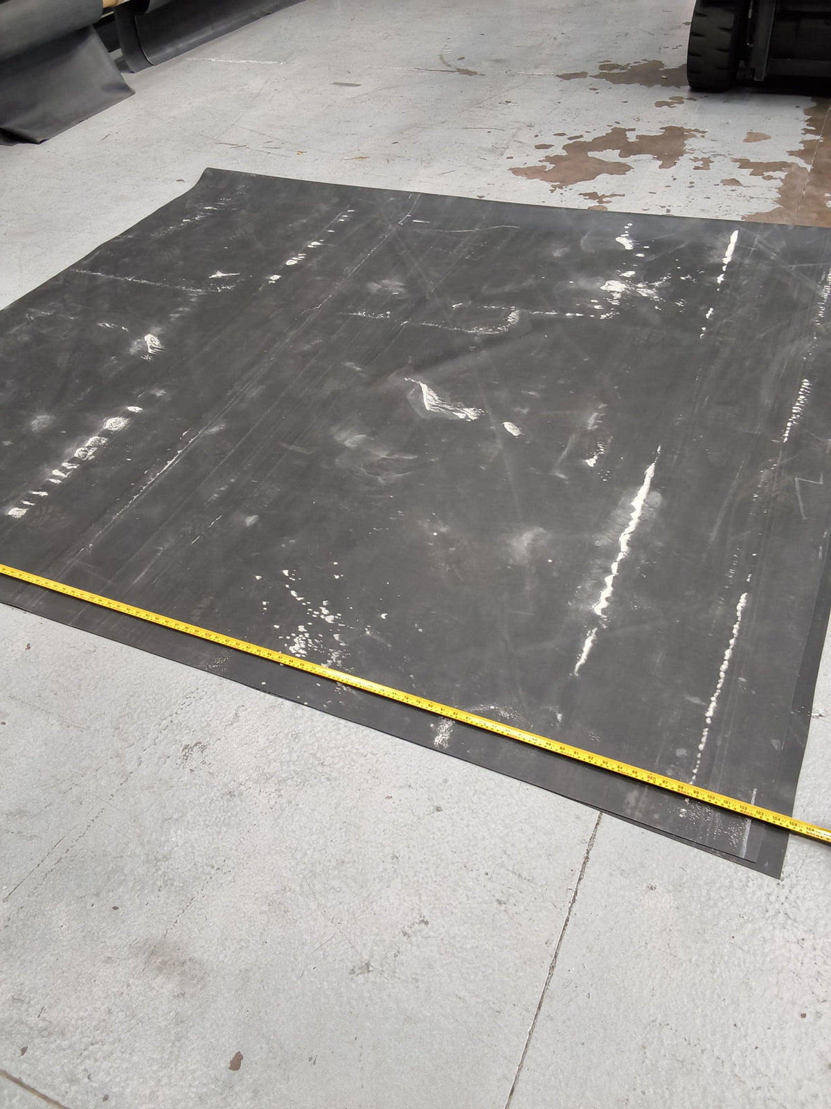 Chalk streaks across a seconds EPDM sheet